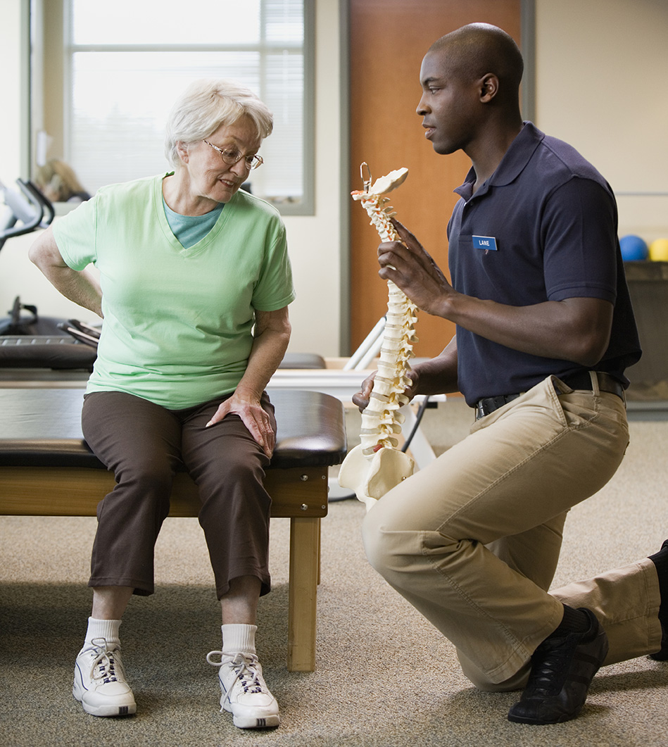 mature woman learning about spine care